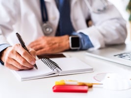 Doctor writing a prescription Doctor writing a prescription